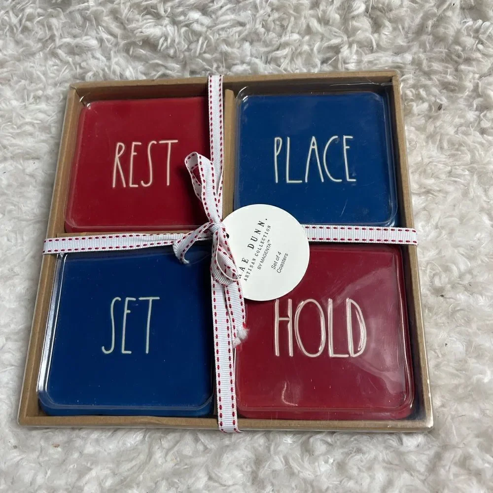 New in box Rae Dunn Ceramic Red & Blue Rest, Place, Stay, Hold Coasters .
